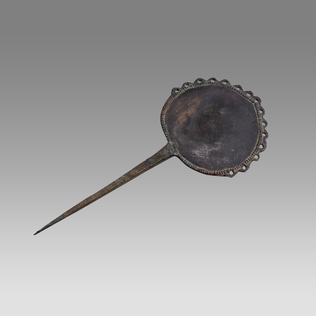 Ancient Luristan Bronze Mirror c.1000 BC.: Ancient Luristan Bronze Mirror c.1000 BC. Size 8 inches length. Unusual cast bronze mirror with handle, choice patina. Provenance: From a NYC collection acquired in the 1960s