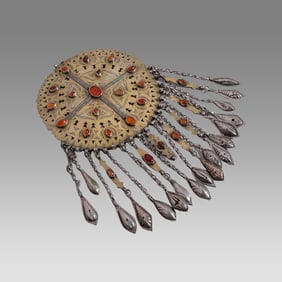 Large antique Tekke Turkoman disc pendant. High grade silver with gold fire gilding and carnelian
