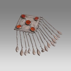 Antique Ersari Turkoman pendant. High grade silver with table cut carnelian stone insets.