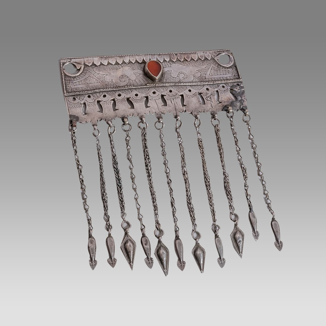 Antique Ersari Turkoman rectangular pendant. High grade silver with table cut carnelian stone inset. (1 of 2)