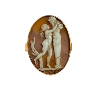A Neoclassical Gold and Onyx Cameo Finger Ring with a Bacchic Scene England, 18th Century.