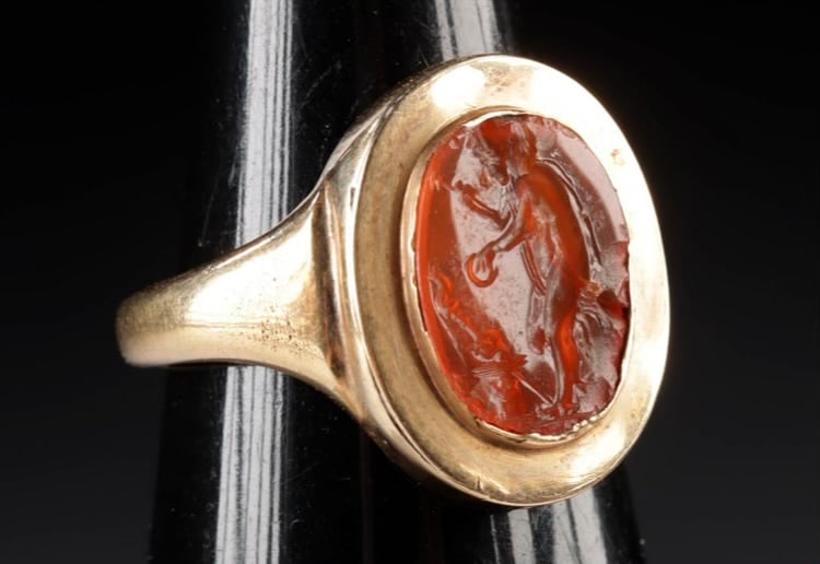 A Neoclassical Carnelian Intaglio in a Gold Ring Western Europe, likely England or France, ca. 18th: A Neoclassical Carnelian Intaglio in a Gold Ring Western Europe, likely England or France, ca. 18th century CE Intaglio size: 1.2 x 1 cm (0.48 x 0.38 in.) Ring setting: 1.7 x 2.1 x 2.2 cm (0.68 x 0.83