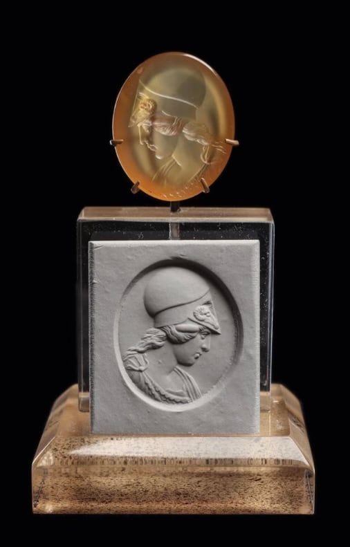Neoclassical Agate Intaglio Bust of Helmeted Athena Europe Ca. 19th century.: A Neoclassical Agate Intaglio Bust of Helmeted Athena Europe, Ca. 19th Century Size: 20 x 24 x 4 mm (7/8" H x 3/4" W)A finely carved Neoclassical agate intaglio depicting the bust of Athena wearing a