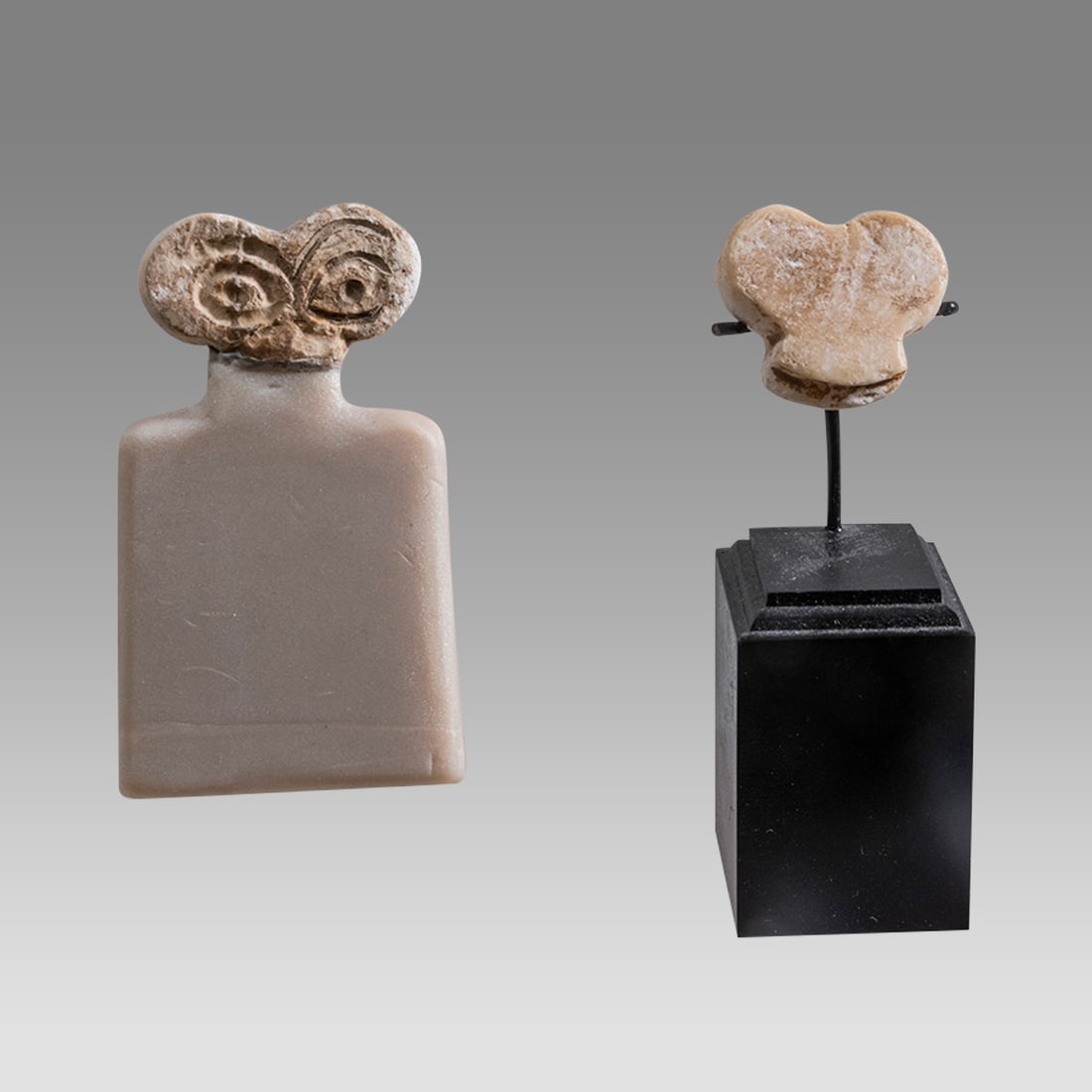 Lot of 2 Ancient Near East, Anatolia, Tell Brak, Eye Idols c.3300-2500 BC.: Lot of 2 Ancient Near East, Anatolia, Tell Brak, Eye Idols c.3300-2500 BC. Size 0 3/4 - 2 1/4 inches high + stand. Lot of 2 flat form cream color stone idols fragments from full figure, with incised d