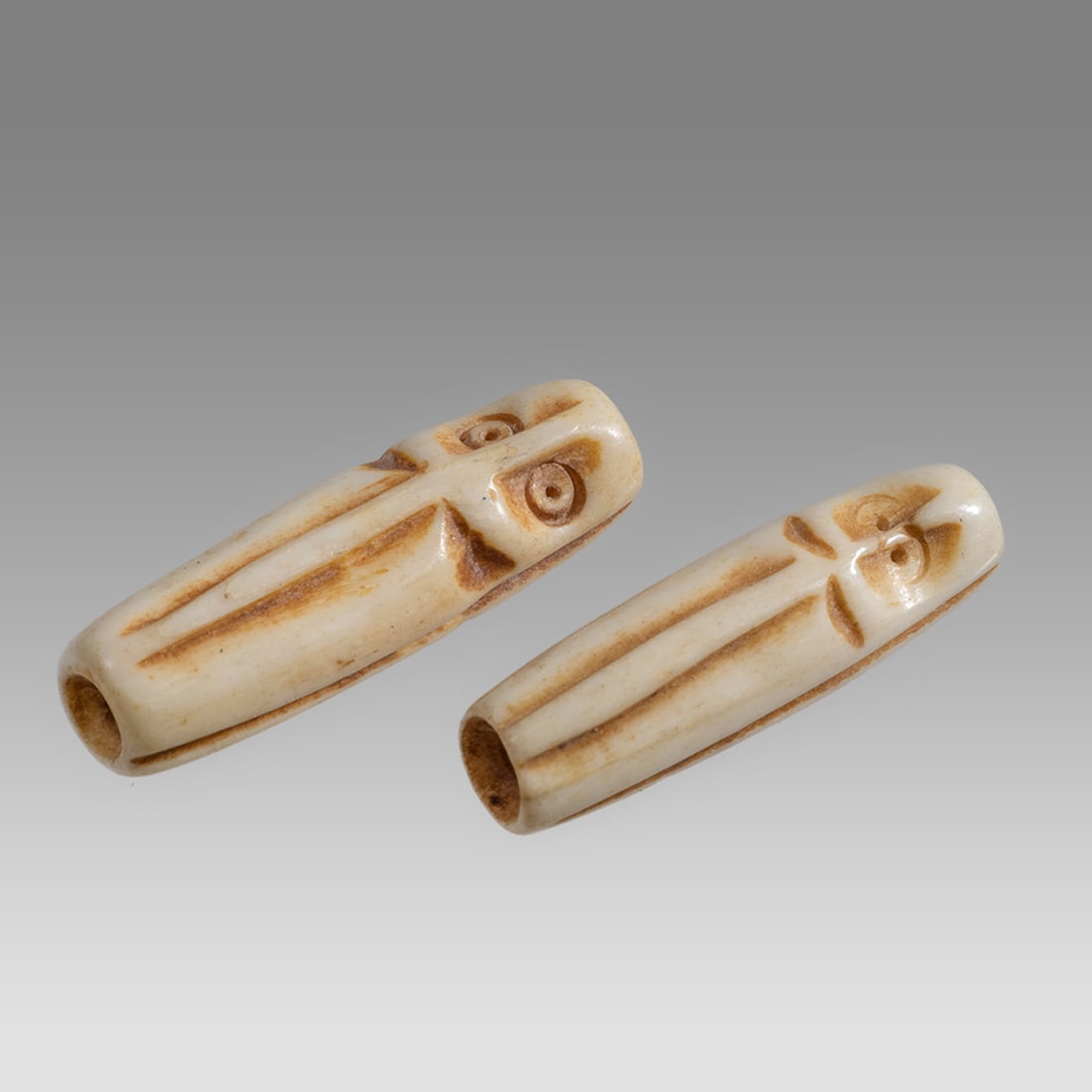 Lot of 2 Ancient Mesopotamian Sumerian Bone Beads With Idol c.3000 BC.: Lot of 2 Ancient Mesopotamian Sumerian Bone Beads With Idol c.3000 BC. Size 25 mm. Lot of 2 Sumerian carved bone beads with Idol on each side. Provenance: Private Collection Of Dale McKeeby, CA acquir