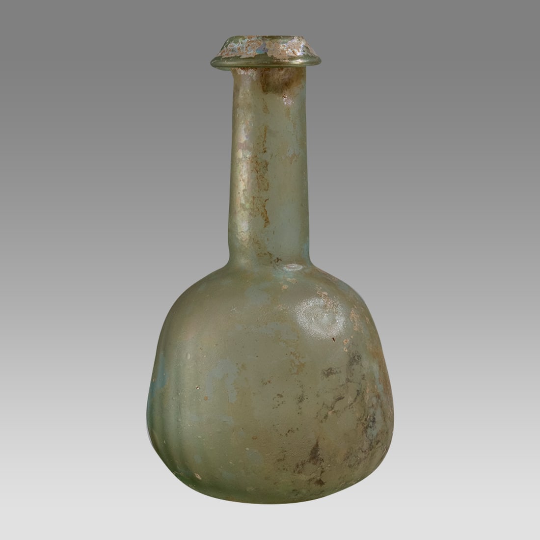 Large Ancient Roman Glass bottle c 2nd- 3rd C CE,: Large Ancient Roman Glass bottle c 2nd- 3rd C CE, Size 7 7/8 inches high, Intact, with light molded ribbing and inward folded rim, Pale Green Glass, Roman. satin-like surfaces, light iridescence Pirif
