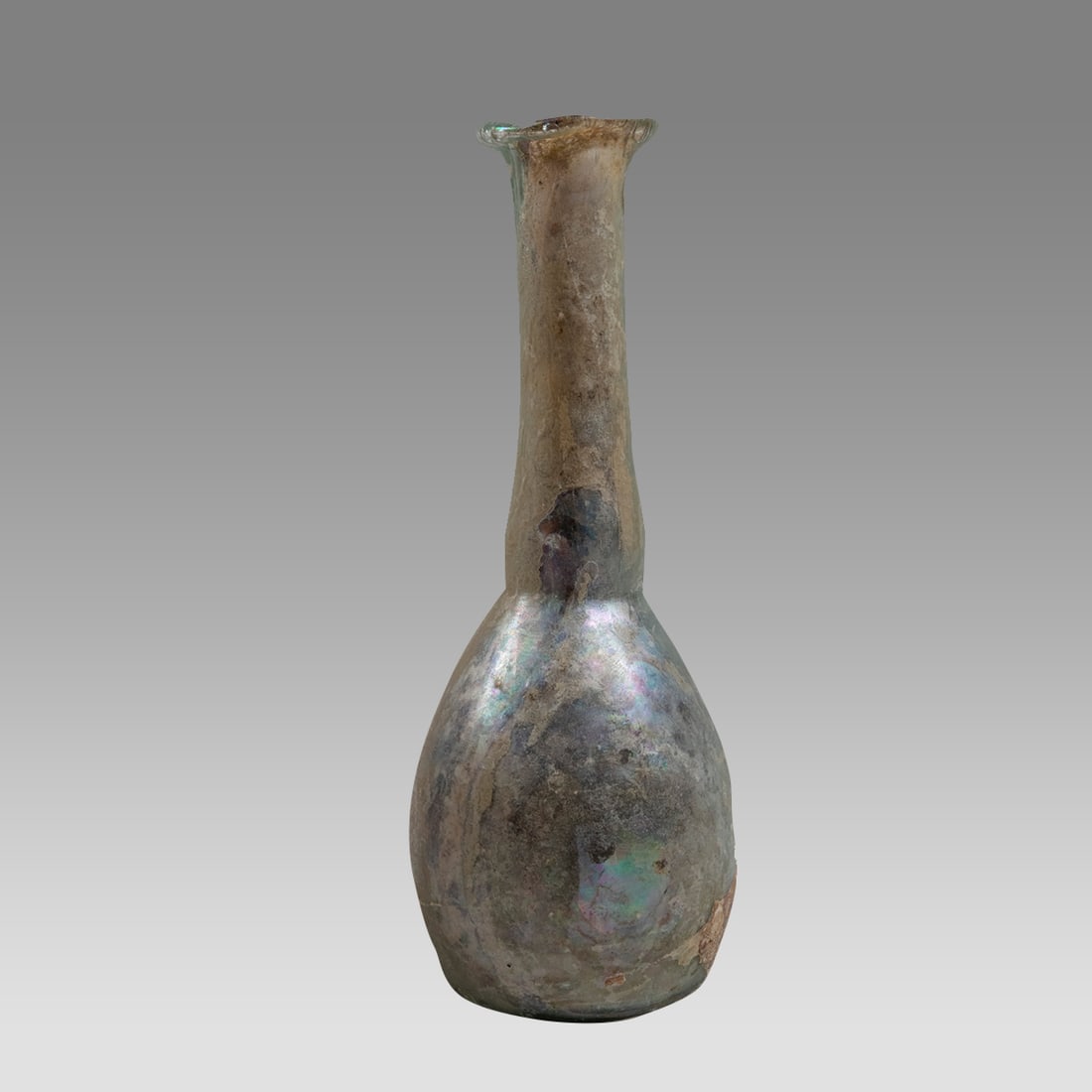 Ancient Roman Glass Bottle c.2nd-3rd century AD.: Ancient Roman Glass Bottle c.2nd-3rd century AD. Size 6 1/4 inches high. Ancient Roman Glass bottle with bulbous body and tall neck with flared rim. lovely form and patina. Provenance: Ex NYC Collecti