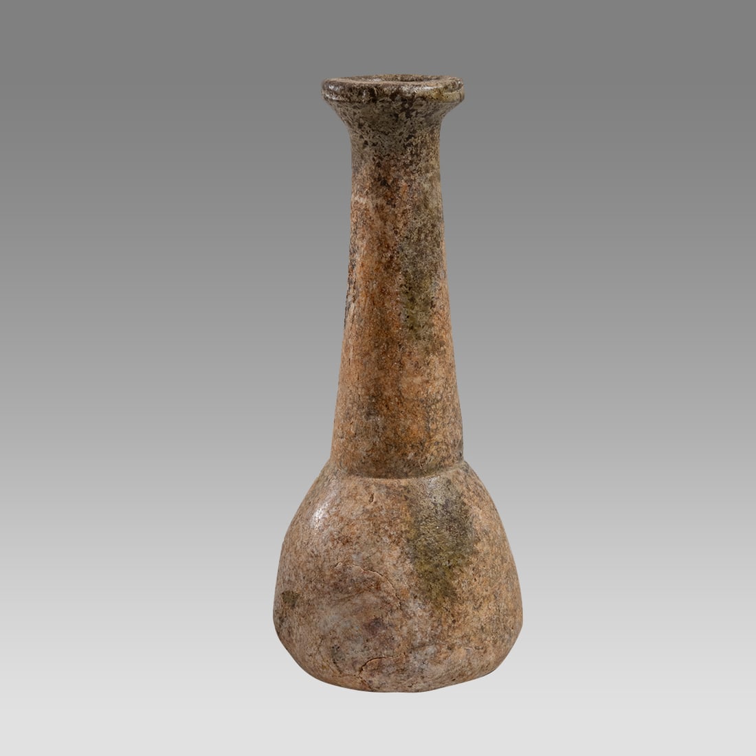 Ancient Roman Glass Bottle c.2nd-3rd century AD.: Ancient Roman Glass Bottle c.2nd-3rd century AD. Size 4 7/8 inches high. Ancient Roman heavy Glass bottle with round body and tall neck with flared rim. lovely form with marble-like patina. Provenance