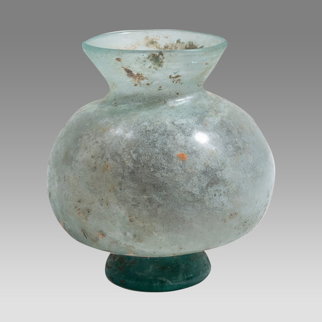 Ancient Roman Footed Glass Jar c.2nd-3rd century AD.: Ancient Roman Footed Glass Jar c.2nd-3rd century AD. Size 3 3/4 inches high. Ancient Roman footed Glass jar with bulbous body and flared rim. Rare form and fine blue patina. Provenance: Ex NYC Collect