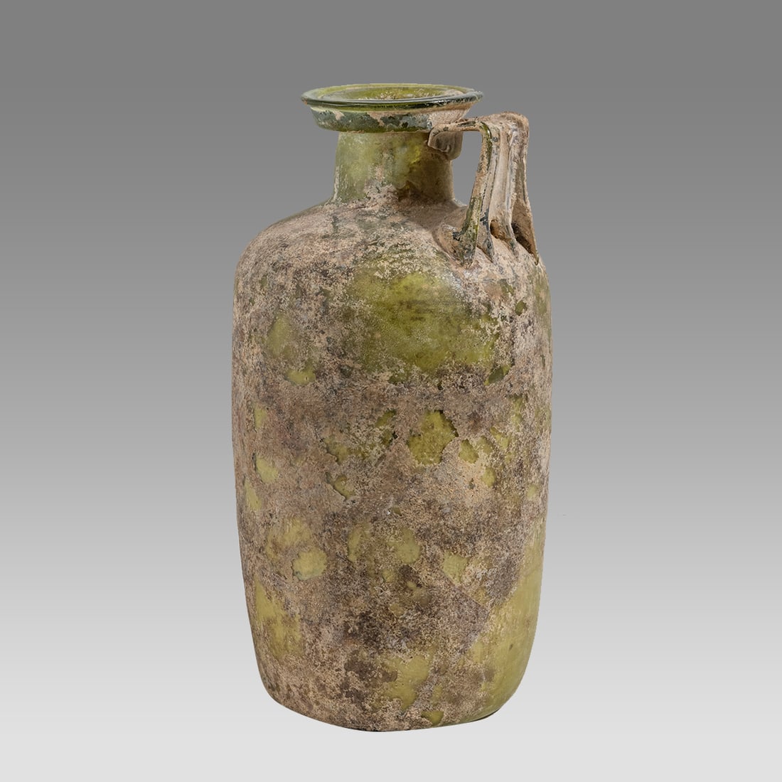 Ancient Roman Large Glass Jug c.2nd-3rd century AD. Size 12 inches high.: Ancient Roman Large Glass Jug c.2nd-3rd century AD. Size 12 inches high. Ancient Roman very large green Glass jug with cylindrical body and short neck flared rim. Strap handle between rim and shoulder