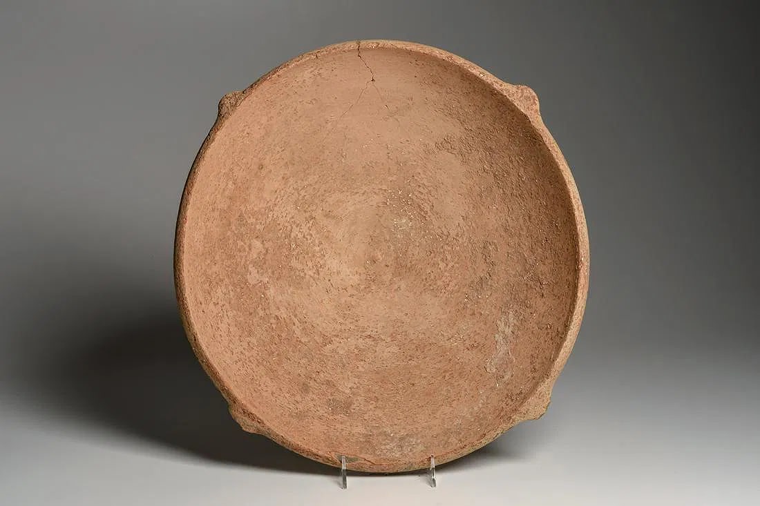 Large Ancient Holy Land Iron Age Pottery Bowl c.1400 BC.: Large Ancient Holy Land Iron Age Pottery Bowl c.1400 BC. Size 18 inches diameter x 4 3/4 inches high. Large salmon-tan color pottery bowl having four lug type handles equidistant spaced around the rim