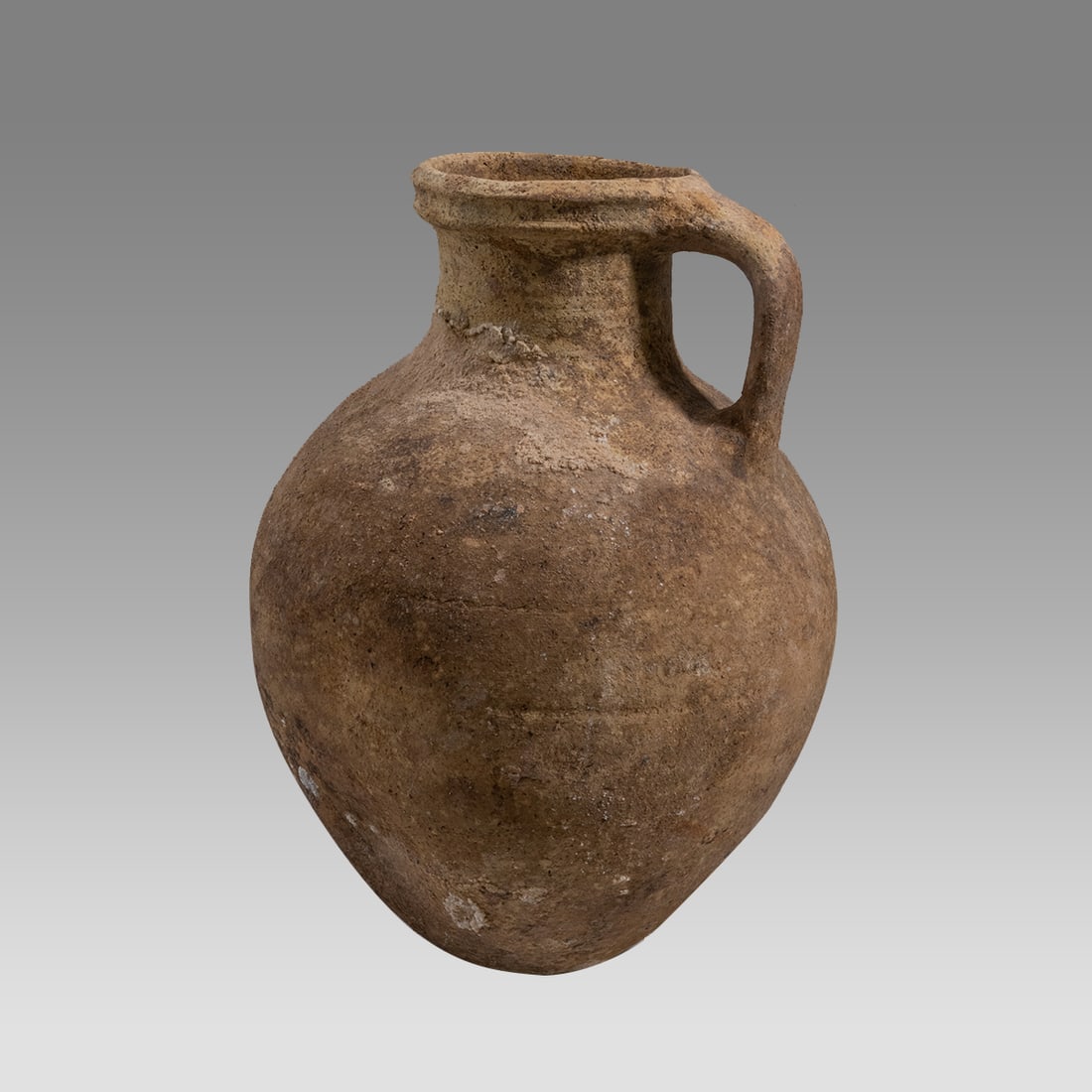 Large Ancient Holy Land Iron Age Pottery Jug c.1100 BC.: Large Ancient Holy Land Iron Age Pottery Jug c.1100 BC. Size 11 1/2 inches high. Large salmon-tan color pottery jug with strap handle, flat base. Provenance: NYC collection, by descent from family, ac