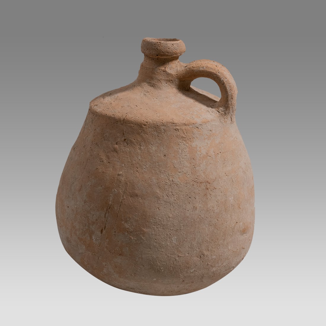 Large Ancient Holy Land Iron Age Pottery Jug Time of David c.1000 BC.: Large Ancient Holy Land Iron Age Pottery Jug Time of David c.1000 BC. Size 11 1/4 inches high. Large pottery jug with loop handle, small ring base. Provenance: NYC collection, by descent from family,