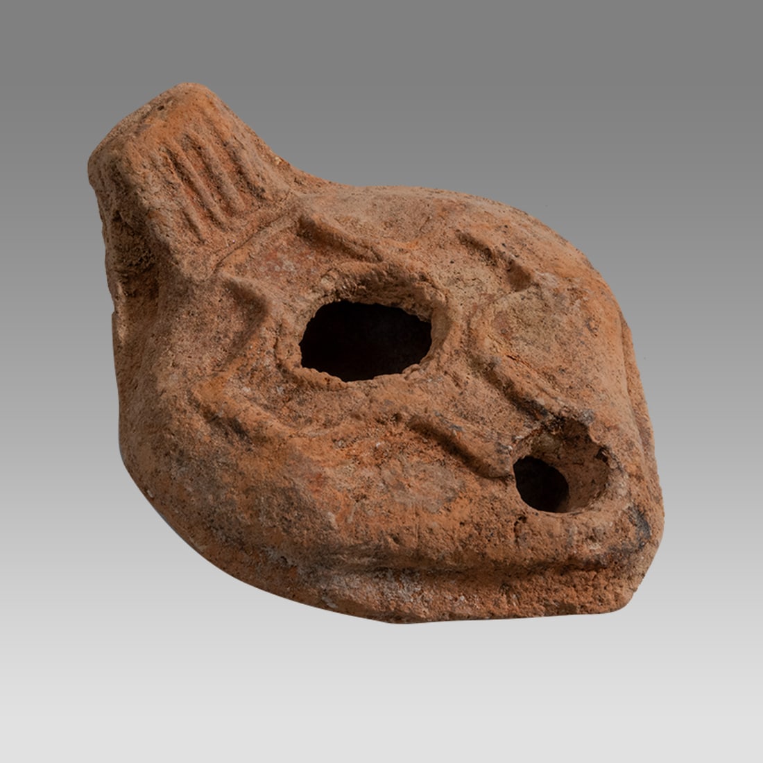 Ancient Holyland Byzantine Terracotta Oil Lamp With Cross c.5th century AD.: Ancient Holyland Byzantine Terracotta Oil Lamp With Cross c.5th century AD. Size 3 3/4 inches length. Fine red Terracotta oil lamp decorated with a Cross. Provenance: From a Private NYC Collection acq