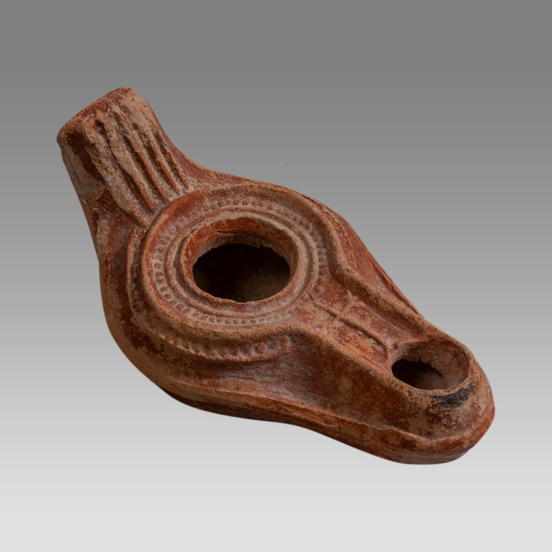 Ancient Holyland Byzantine Terracotta Oil Lamp With Cross c.5th century AD.: Ancient Holyland Byzantine Terracotta Oil Lamp With Cross c.5th century AD. Size 4 1/4 inches length. Fine red Terracotta oil lamp decorated with a Cross. Provenance: From a Private NYC Collection acq