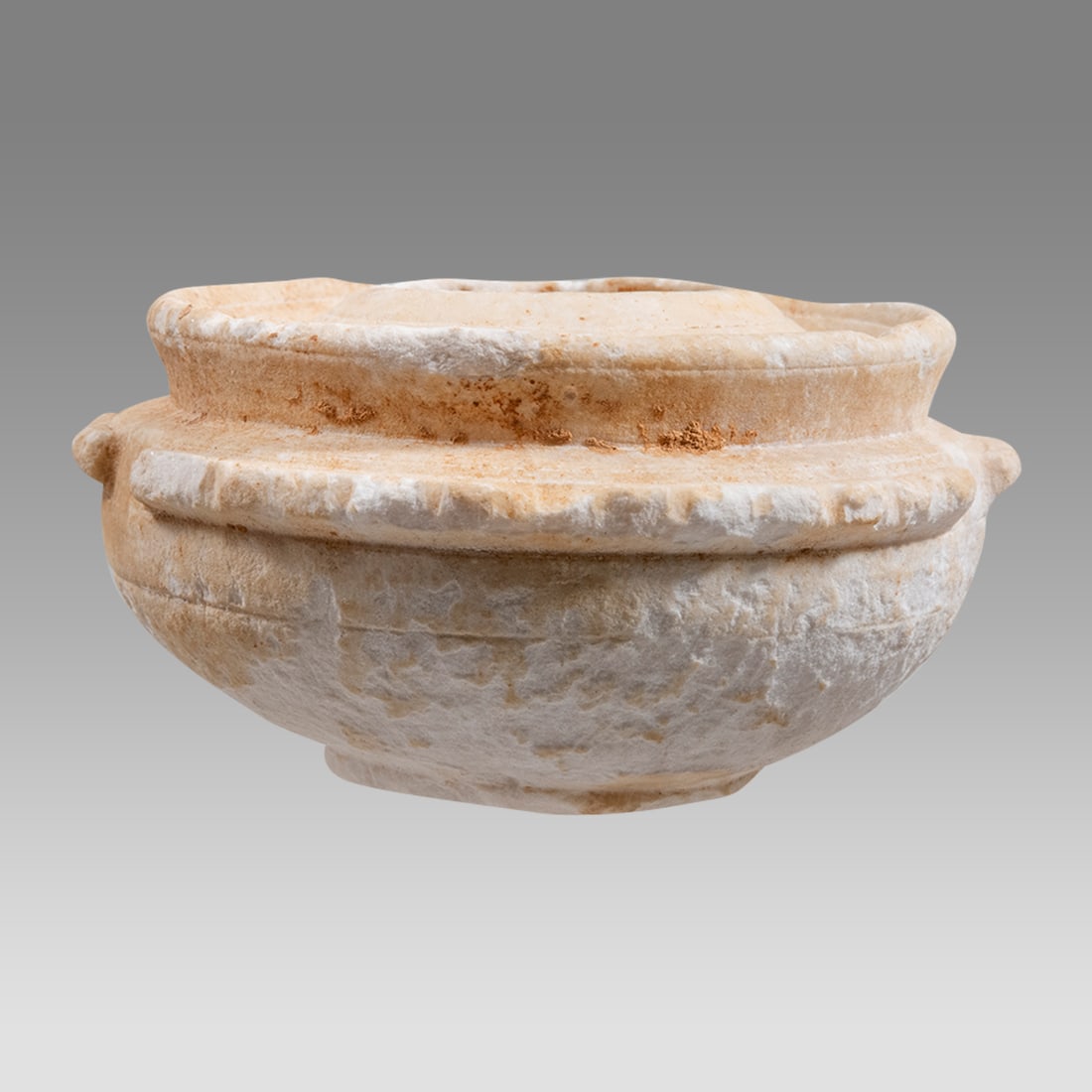 Ancient Holyland Byzantine Stone Bowl c.5th century AD.: Ancient Holyland Byzantine Stone Bowl c.5th century AD. Size 3 1/4 inches diameter. A small carved stone bowl with twin lug handles, rounded base. Provenance: From a Private NYC Collection acquired in