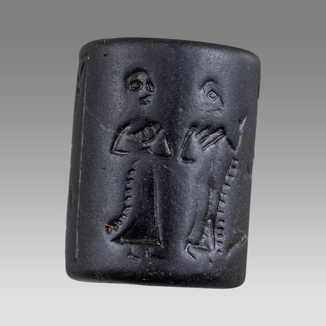 Near Eastern Stone Cylinder Seal,: Near Eastern Stone Cylinder Seal, Size 23 x 18 mm. Black stone small cylinder seal with figures and inscriptions, Age unknown. Ex NYC Collection acquired in the USA Market 1990s