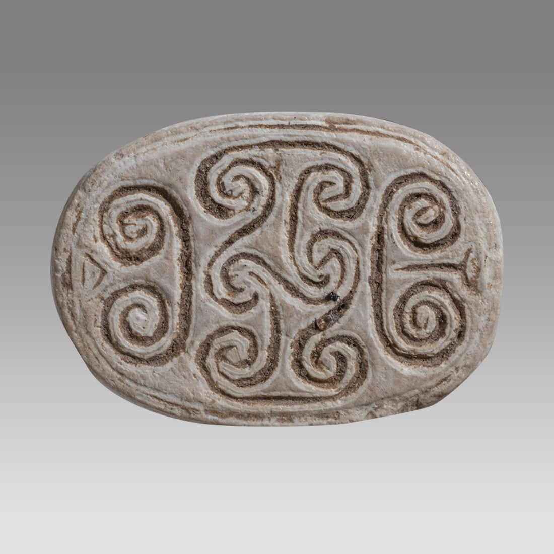 Ancient Egyptian Steatite Stone Scarab, New Kingdom c.1550-1077 BC.: Ancient Egyptian Steatite Stone Scarab, New Kingdom c.1550-1077 BC. Size 16 x 11 mm. Carved hard steatite stone scarab carved with scroll design at back. suspension hole through. Provenance: Ex Privat