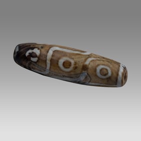 A Tibetan Agate 9 Eyes Dzi Bead.