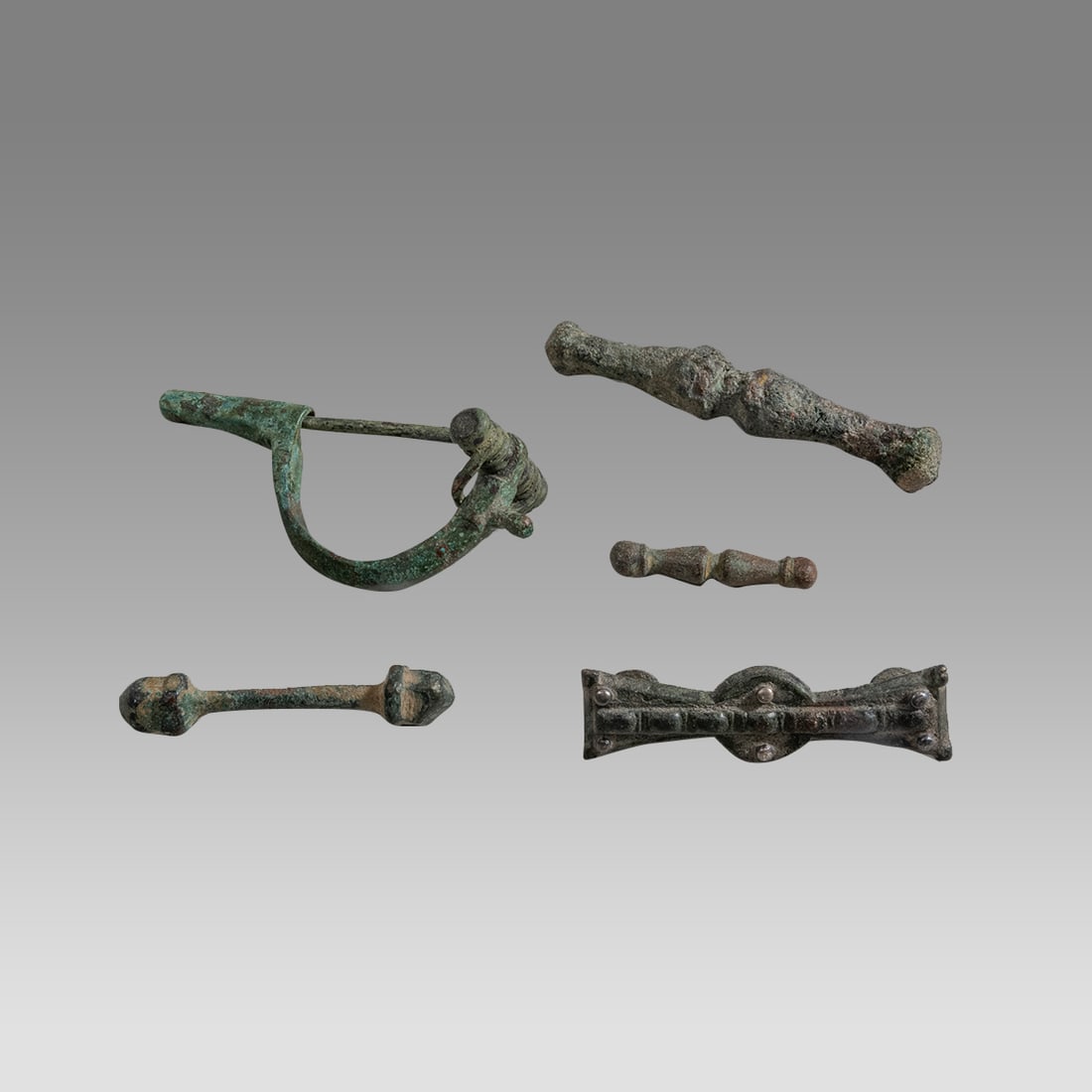 Lot of 5 Bronze Clothing Accoutrements / accessories – Roman – 1st to 4th centuries AD.: Lot of 5 Bronze Clothing Accoutrements / accessories. Roman c.1st to 4th centuries AD. Size 1 1/4 - 2 1/2 inches length. Includes: 3 clothing bars for holding together clothing: intact spring-type fib