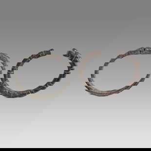 Ancient Roman Bronze Bracelets c.2nd century AD.(2): Ancient Roman Bronze Bracelets c.2nd century AD.(2) Size 2 1/2 - 2 3/4 inches diameter. Lot of 2 Ancient Bronze Bracelets snake form with choice patina. Provenance: Private collection, bought via Lond