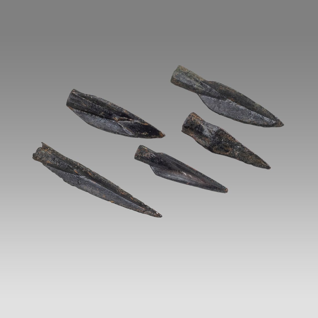 Lot of 5 Ancient Roman Bronze Arrow Heads c.1st-2nd century AD.: Lot of 5 Ancient Roman Bronze Arrow Heads c.1st-2nd century AD. Size 1 1/8 - 1 3/4 inch length. A collection of 5 bronze socketed type Arrow heads with choice patina. Provenance: Private collection, b