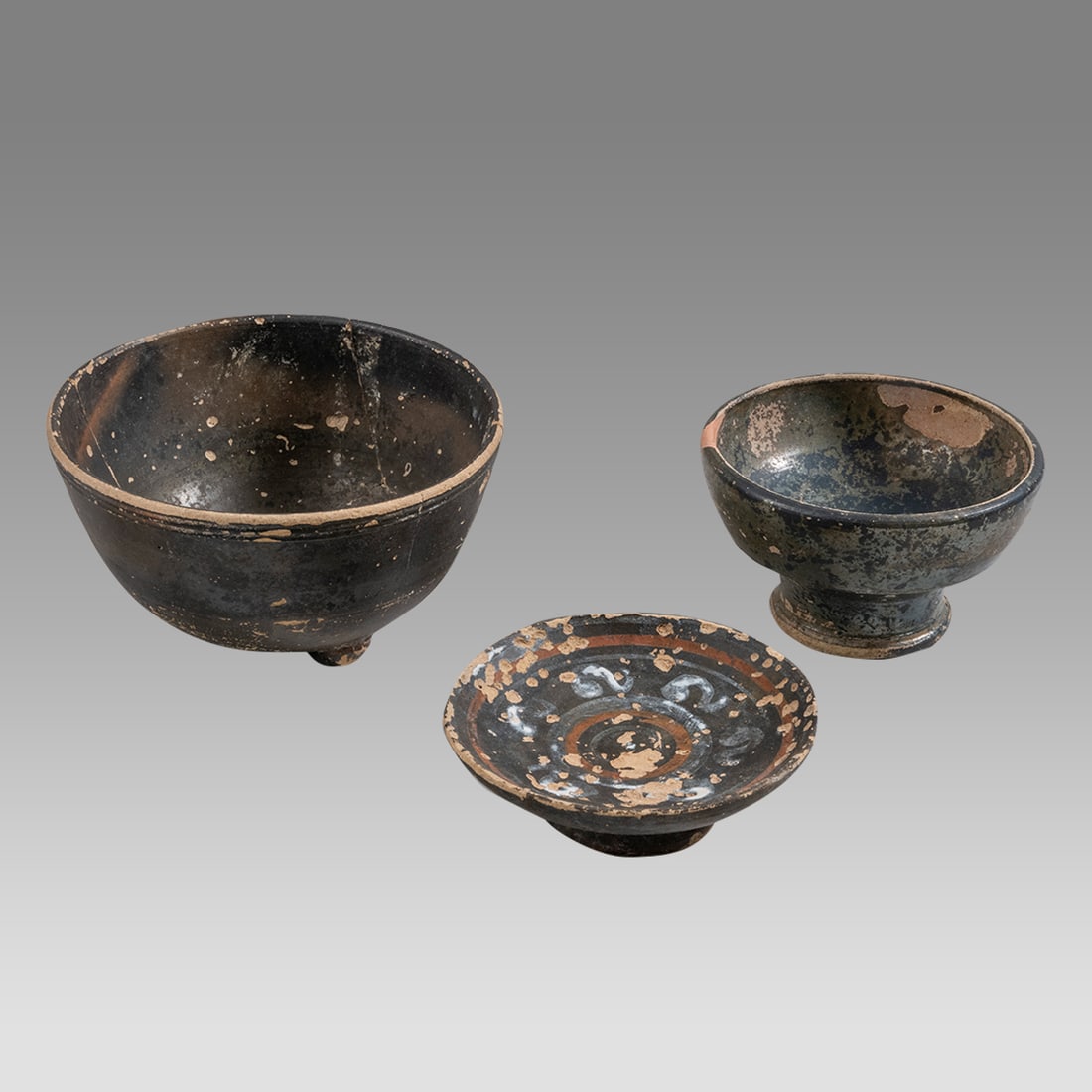 Ancient Greek Magna Graceia Blackware Pottery Bowls c.4th century BC.(3): Ancient Greek Magna Graceia Blackware Pottery Bowls c.4th century BC.(3) Size 2 3/4 - 3 3/4 inches diameter. 0 7/8 - 2 inches high. A collection of 3 blackware pottery footed bowls. Provenance: Privat
