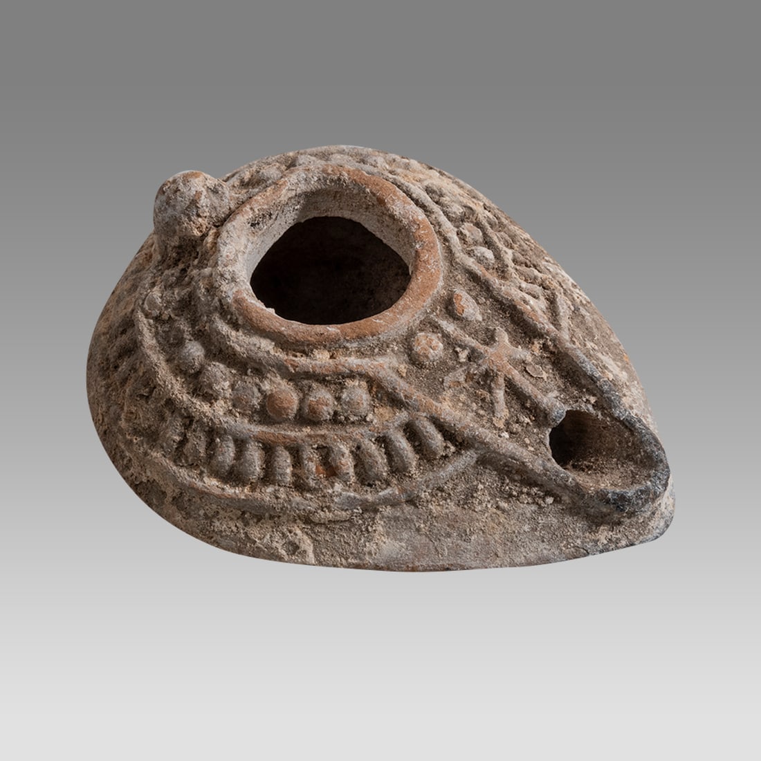 Ancient Byzantine Terracotta Oil Lamp with Cross c.6th century AD.: Ancient Byzantine Terracotta Oil Lamp with Cross c.6th century AD. Size 3 1/2 inches length. Unusual nice size terracotta oil lamp with a Cross at spout and decorated shoulder. Back side with a star. 