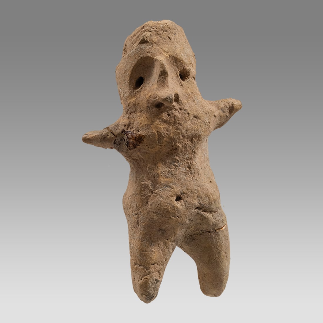 Ancient Mesopotamian Terracotta Idol c.1000 BC.: Ancient Mesopotamian Terracotta Idol c.1000 BC. Size 3 inches high. A small terracotta idol with short spread out hands. Provenance: Private collection, bought via London Art Market previously in a 19