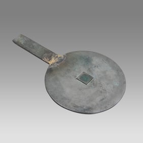 A Chinese Bronze Mirror.