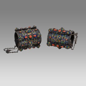 A large Pair Of Moroccan Silver and Enamel Bracelets.
