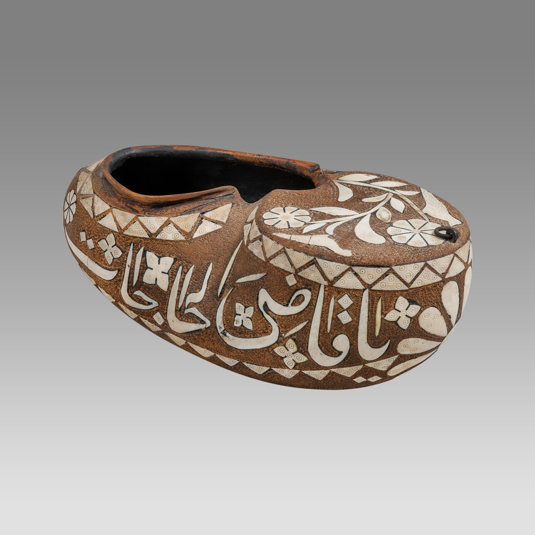 20th century Islamic Syrian Bone inlaid Wood Kashkul With Arabic Calligraphy.: 20th century Islamic Syrian Bone inlaid Wood Kashkul With Arabic Calligraphy. Size 13 1/2 inches length, 5 1/2 inches wide. A large carved wood Kashkul, begging basket, cBone inlaid with Arabic callig