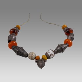 Mauritania, Natural and Phenolic Amber Trade Beads With Large Silver Beads.