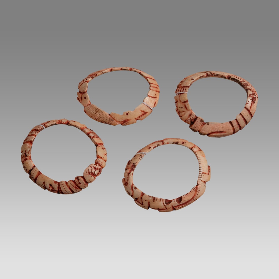 Maya Style Shell Bracelets (4) Set of four carved shell bracelets, (1 of 2)