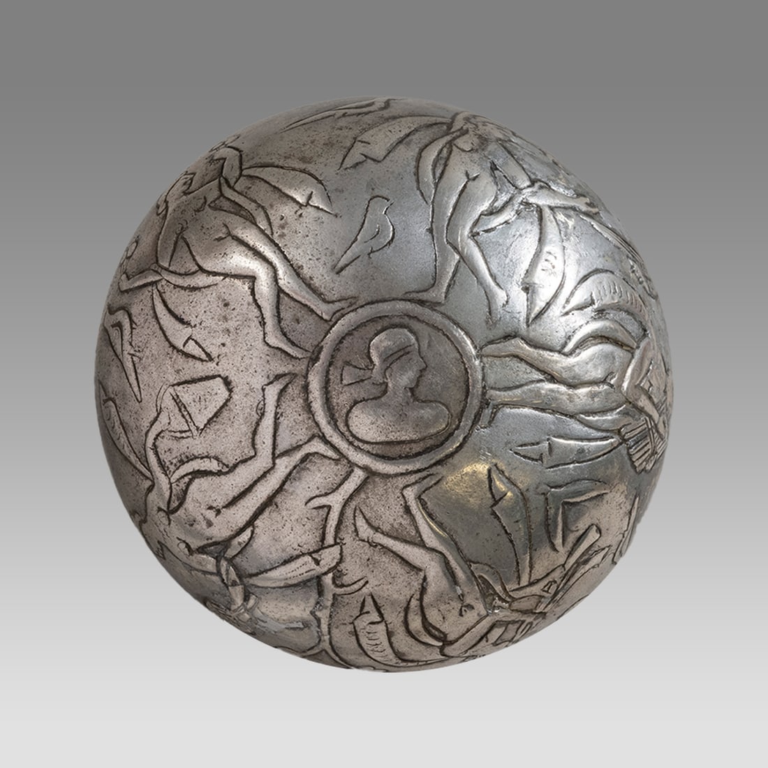 Sasanian Style Silver bowl with Figures.: Sasanian Style Silver bowl with Figures. Size 5 1/2 inches diameter, 1 5/8 inches high. Sasanian style silver bowl decorated with five nude female figures, birds in field. The center with a bust of a 