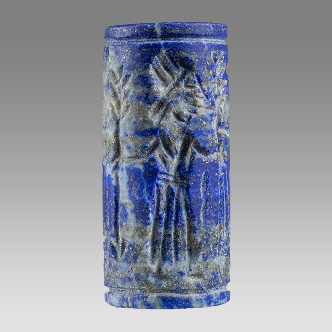 Mesopotamian Style Lapis Lazuli Cylinder Seal.: Mesopotamian Style Lapis Lazuli Cylinder Seal. Size 35 x 16 mm. Carved lapis lazuli stone large cylinder seal with presentation scene. suspension hole. Not ancient. Provenance: Private London collecti