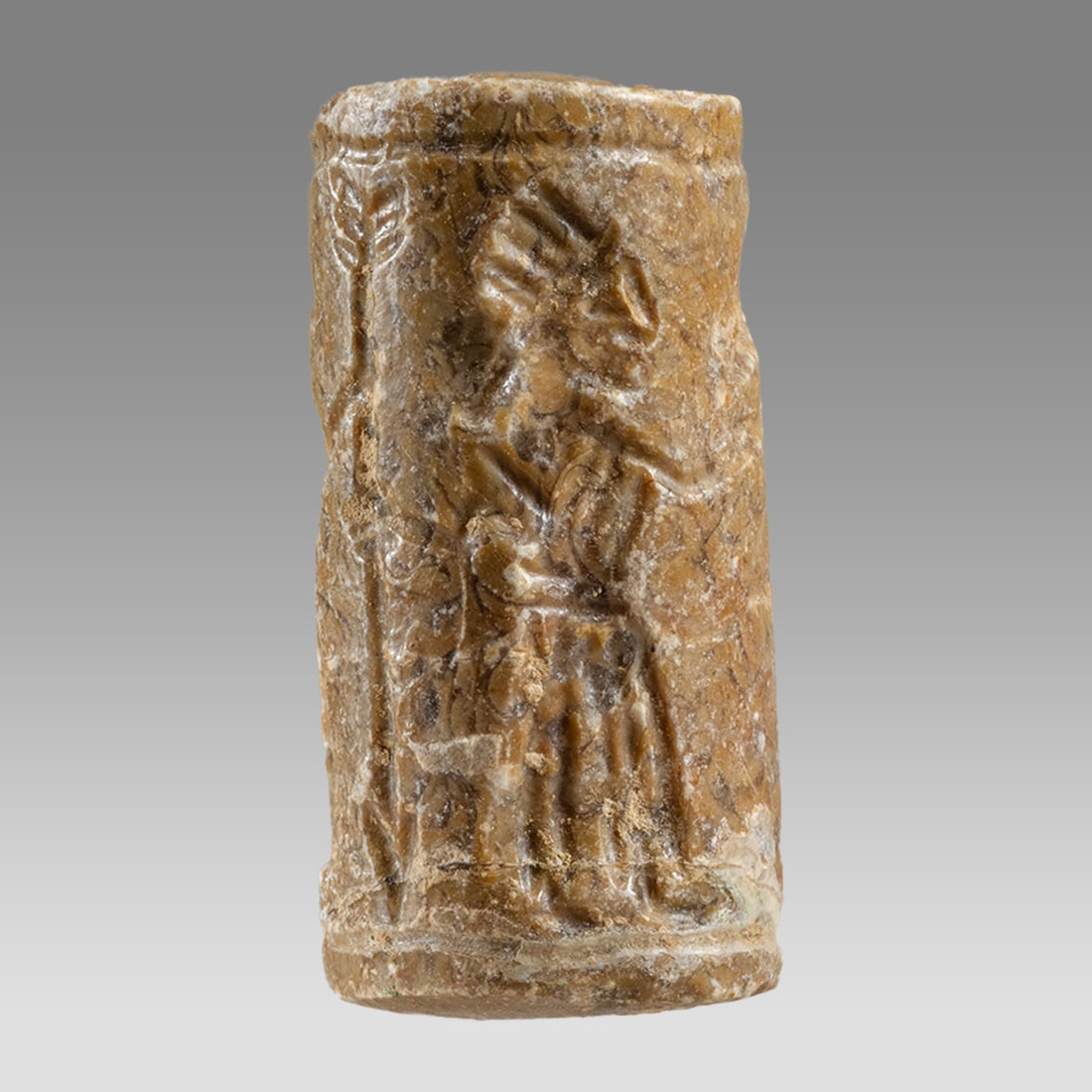 Mesopotamian Style Stone Cylinder Seal.: Mesopotamian Style Stone Cylinder Seal. Size 38 x 18 mm. Carved stone large cylinder seal with presentation scene. suspension hole. Not ancient. Provenance: Private London collection; previously acqui