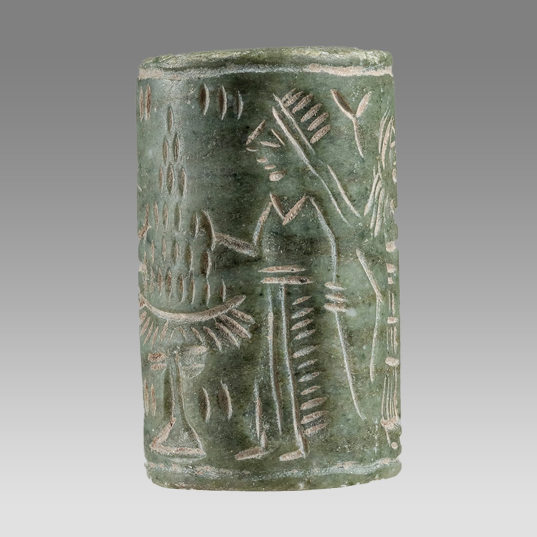 Mesopotamian Style Stone Cylinder Seal.: Mesopotamian Style Stone Cylinder Seal. Size 31 x 19 mm. Carved stone large cylinder seal with presentation scene. suspension hole. Not ancient. Provenance: Private London collection; previously acqui