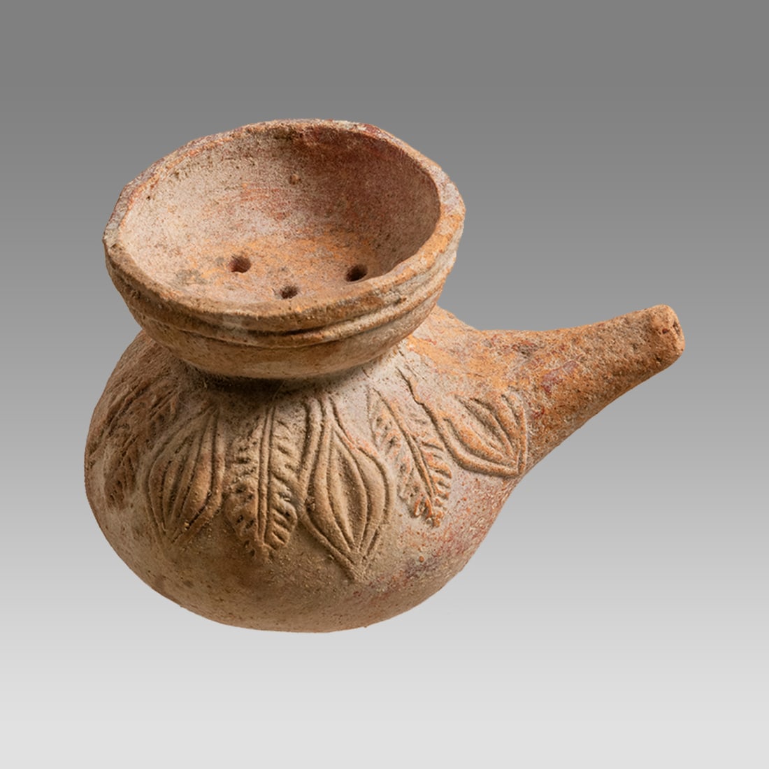 Ancient Holyland Roman Terracotta baby Feeder c. 1st century AD.: Ancient Holyland Roman Terracotta baby Feeder c. 1st century AD. Size 3 3/4 inches length, 3 inches width. Rare red terracotta baby feeder decorated with leafs around the shoulder, flared rim and hole