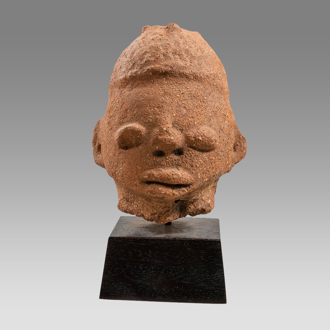Nok Terracotta Head Of A Man Possibly ancient?: Nok Terracotta Head Of A Man Possibly ancient? Size 6 inches high + stand, 4 1/2 inches width. 3 3/4 inches depth. Nok culture Nigeria. Red terracotta head of a man. Custom mounted. Ex NYC Collection