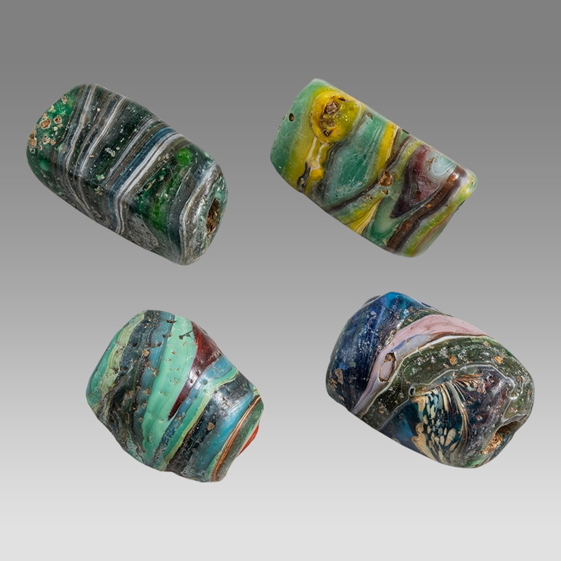 Lot of 4 Islamic Mosaic Glass Large Beads.: Lot of 4 Islamic Mosaic Glass Large Beads. Size 1 1/4 - 1 1/2 inch length. A collection of 4 large mosaic glass beads, possibly ancient? Ex Private NYC Collection acquired in the USA Market.