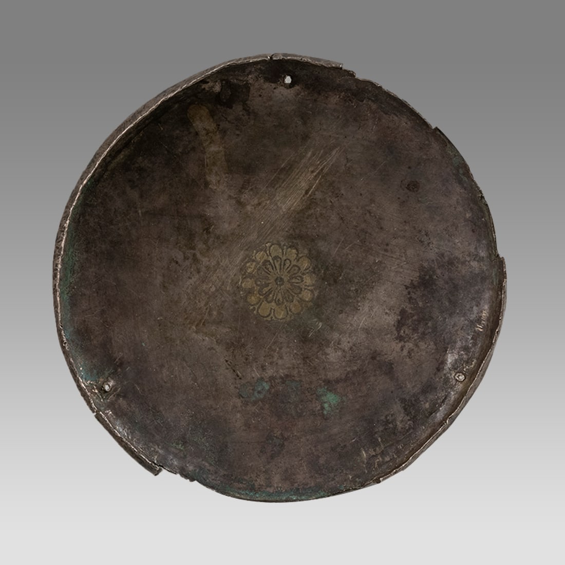 A Sasanian Silver Bowl c.6th century AD.: A Sasanian Silver Bowl c.6th century AD. Size 6 1/2 inches diameter, 1 1/4 inches high. Fine silver bowl with floral design in the center. Ex Silk Road NYC.
