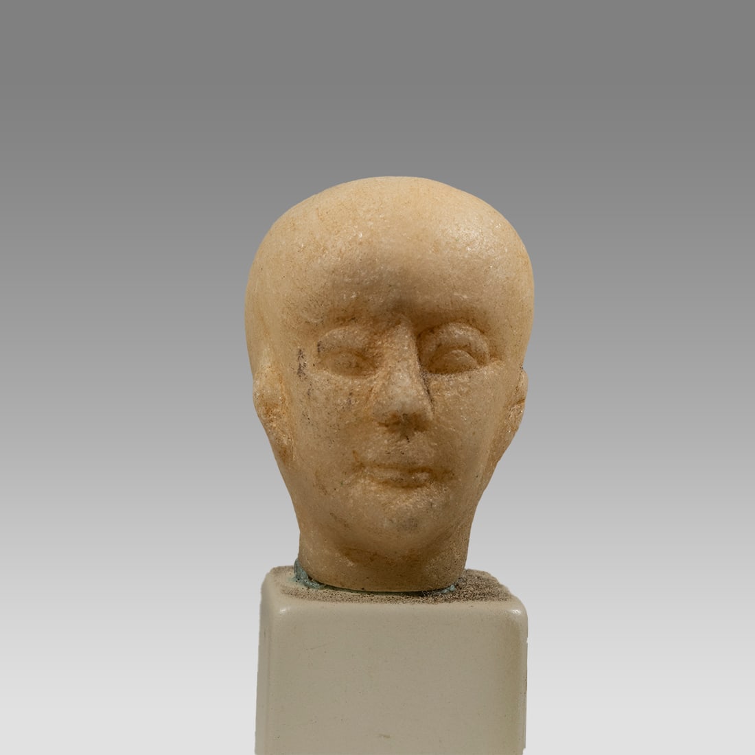 Egyptian Style Marble Head of a Noble.: Egyptian Style Marble Head of a Noble. Size 1 1/4 inch high, 1 inch wide, 1 1/4 inch depth. A very finely carved marble or alabaster head of a noble or royal personnage having a bald head and gentle f