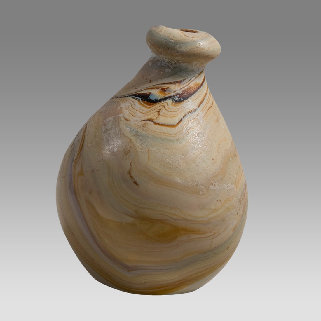 Ancient Roman Marbleized Glass Vessel c.1st-3rd century AD.: Ancient Roman Marbleized Glass Vessel c.1st-3rd century AD. Size 3 3/8 inches high, 2 1/4 inches width. Unusual Marbleized glass vessel with beautiful pattern. Provenance: Private VA, USA collection a
