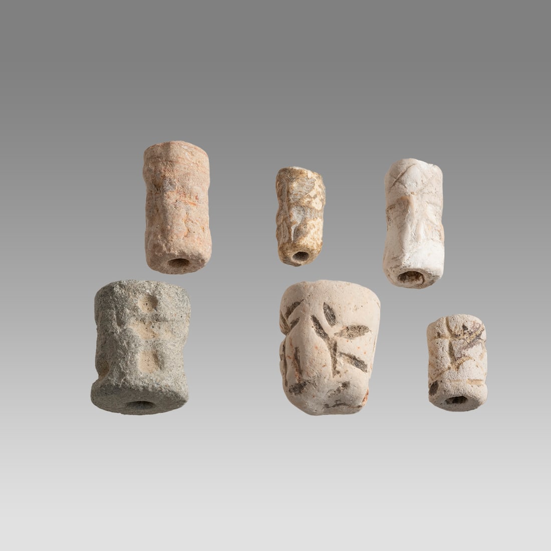 Lot of 6 Ancient Mesopotamian Stone Cylinder Seals c.3000 BC.: Lot of 6 Ancient Mesopotamian Stone Cylinder Seals c.3000 BC. Size 17-25 mm. A collection of 6 mesopotamian Sumerian stone cylinder seals. Provenance: Ex Florida collection acquired in the USA Market.