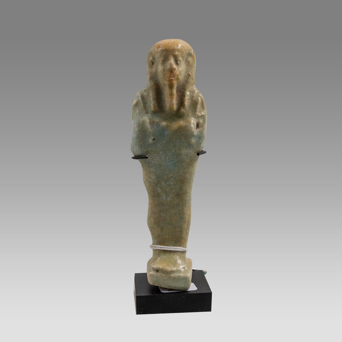 Ancient Egyptian Green Faience Ushabti Late period c.664-332 BC.: Ancient Egyptian Green Faience Ushabti Late period c.664-332 BC. Size 5 inches high. + mount. Late Period, 26th Dynasty, ca. 664 to 332 BCE. Fine green faience ushabti, mummiform figure standing on re