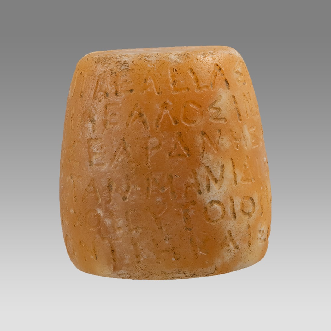 A Roman Style Alabaster Pestle With Latin Isncription.: A Roman Style Alabaster Pestle With Latin Isncription. Size 2 5/8 inches high, 2 1/2 inches diameter. Carved Alabaster pestle with Latin Inscriptions. Not ancient. Provenance: Ex Private Florida Colle
