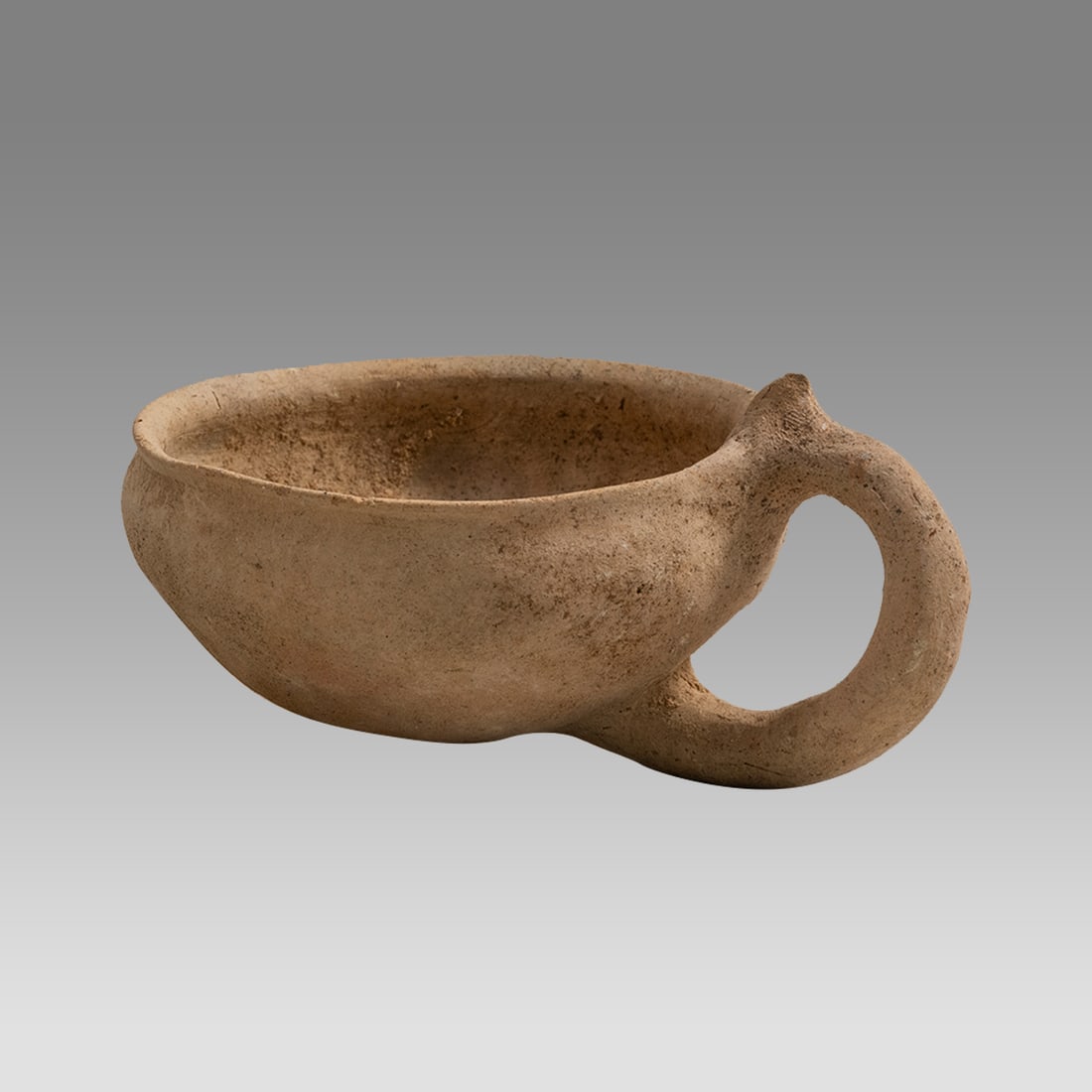 Ancient Holyland Terracotta Milk Cup Bronze Age c.2000 BC.: Ancient Holyland Terracotta Milk Cup Bronze Age c.2000 BC. Size 4 3/4 inches length, 2 1/4 inches high. Fine red terracotta milk cup with loop handle. Provenance: Ex Private Florida Collection acquire