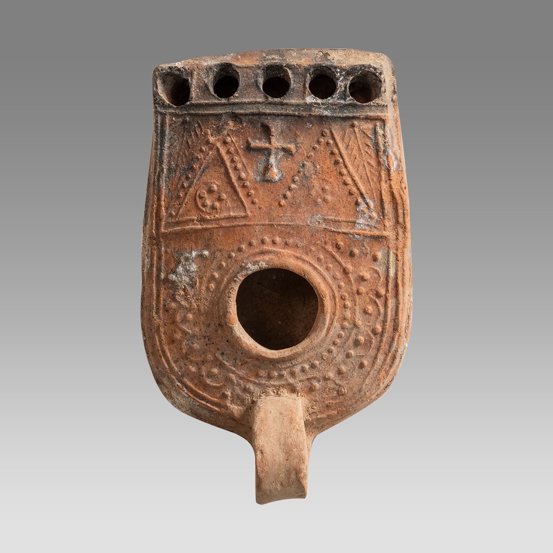 Ancient Holy Land Byzantine, Oil Lamp c.4th cent CE.: Ancient Holy Land Byzantine, Oil Lamp c.4th cent CE. Multi-nozzle Ancient terracotta oil lamp. Size 5 1/4 inches length, 3 inches width. with shovel-shaped body, central filling hole, and five spouts