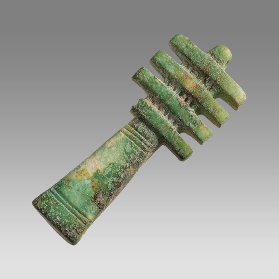 Ancient Egyptian Faience Djed, Pillar Amulet c.664-332 BC.: Ancient Egyptian Faience Djed, Pillar Amulet c.664-332 BC. Size 31 x 12 mm. A green faience Djed pillar amulet with Suspension loop. Provenance: Private collection, bought via London Art Market previo